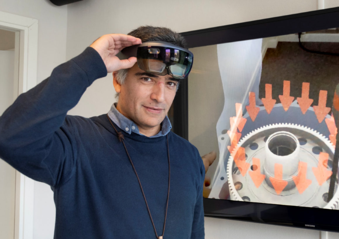 KIT-AR's founder and CEO Manuel Oliveira wearing Augmented Reality glasses for manufacturing