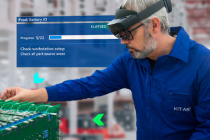 Human worker on manufacturing assembly line sees the next task with augmented reality instructions displayed on a blue rectangle